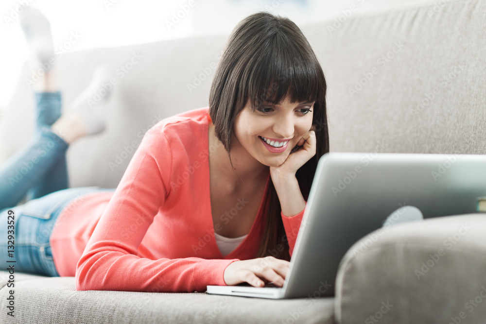 Young woman connecting with a laptop Young woman connecting with a laptop