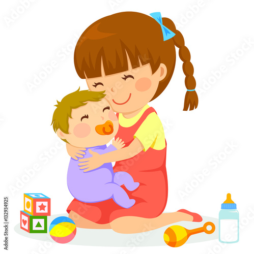 little girl hugging a baby