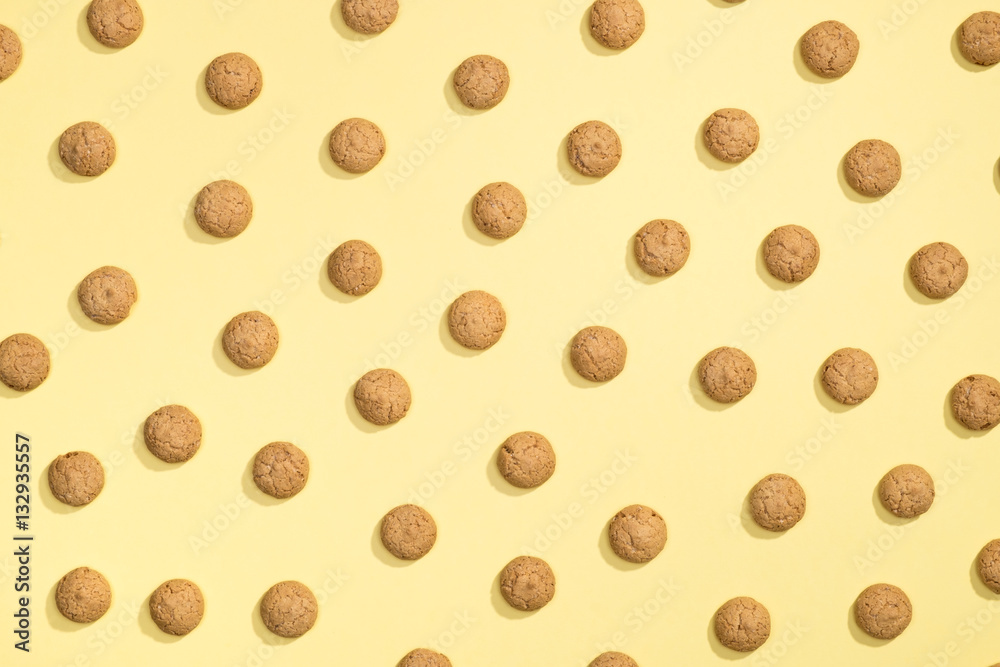 Pattern of cookies on a yellow background Pattern of cookies on a yellow background