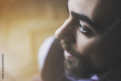 Portrait of a man with beard looking away - hipster look.