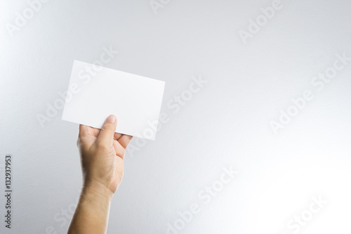 Hand hold blank photo paper card
