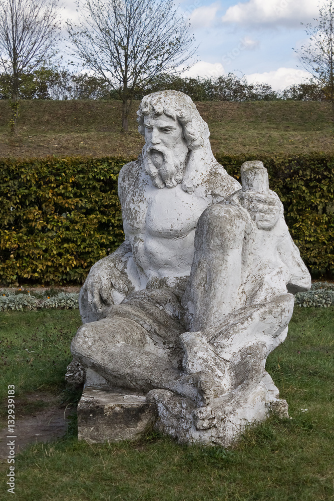 Neptune statue in the garden of the castle in Zolochiv Ukraine. Vertical position