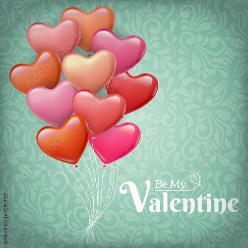 Pink and red heart shaped balloons for Valentine's Day on floral pattern background