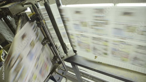 rotation of conveyor belt of printed products in plant.