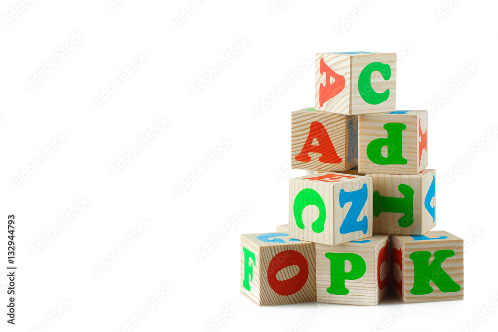 Wooden playing cubes with letters isolated on white background. Wooden blocks of the alphabet. Wooden playing cubes with letters isolated on white background. Wooden blocks of the alphabet.