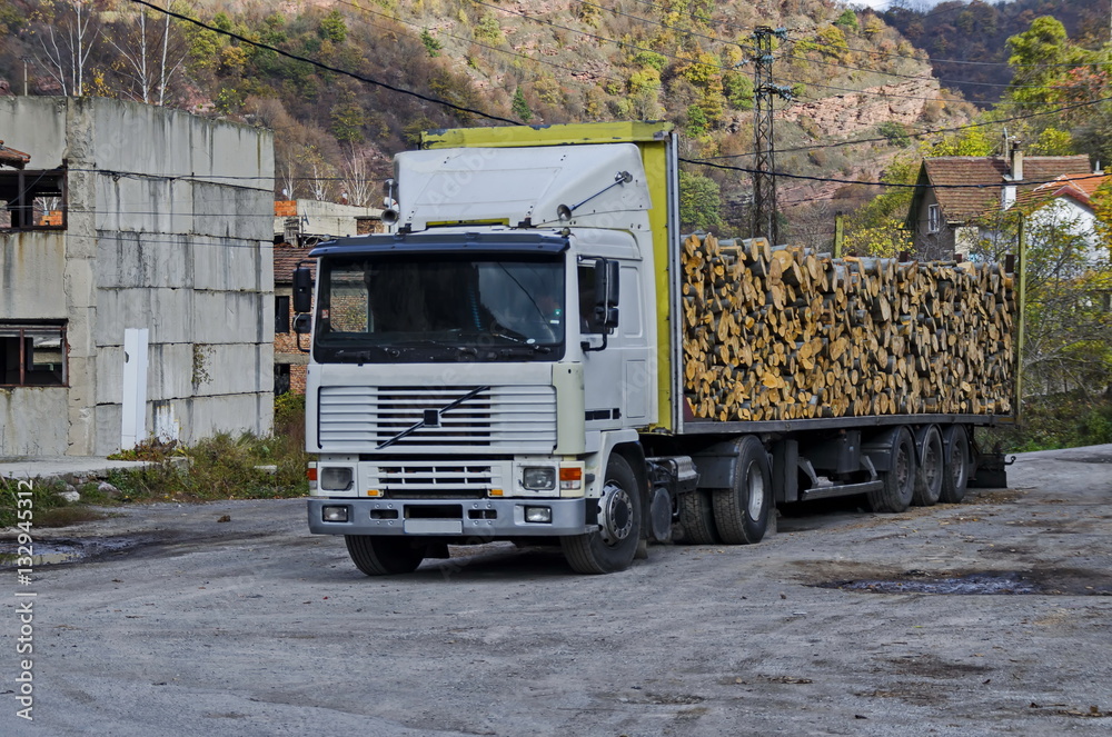 Big lorry carry stack firewood in Lakatnik, Bulgaria 