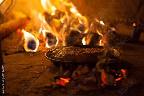 Smoked meat in the fireplace