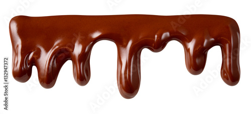 Melted chocolate syrup is dripping. Streams with drops isolated
