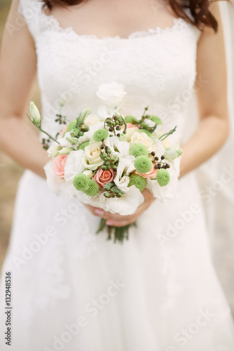 Bridal bouquet. Bouquet in the hands of the bride.