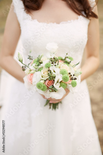 Bridal bouquet. Bouquet in the hands of the bride.