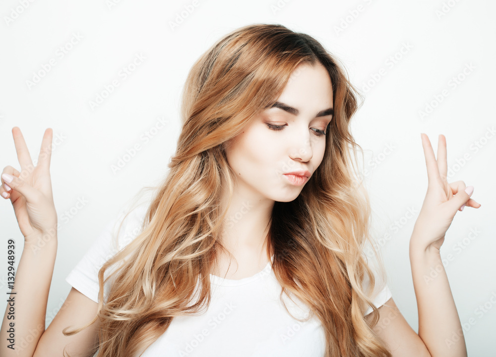 lovely woman showing victory or peace sign lovely woman showing victory or peace sign