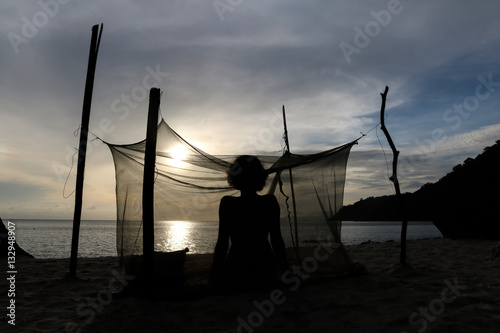 Woman camping alone on the beach at ang thong island.Thailand  photo