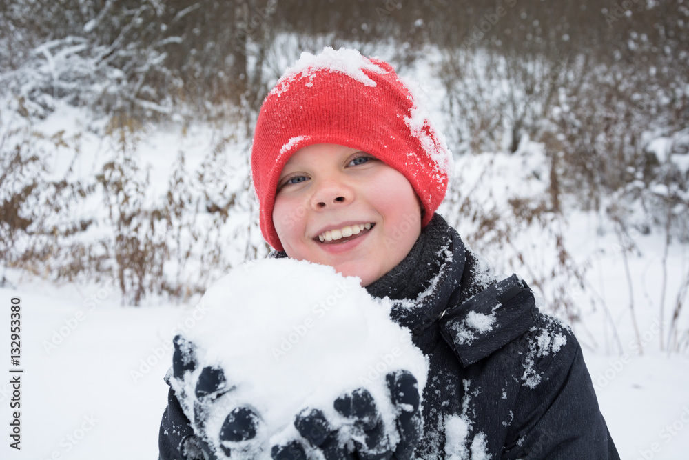 Teenager smiling and playing with snow. Wintertime. Teenager smiling and playing with snow. Wintertime.