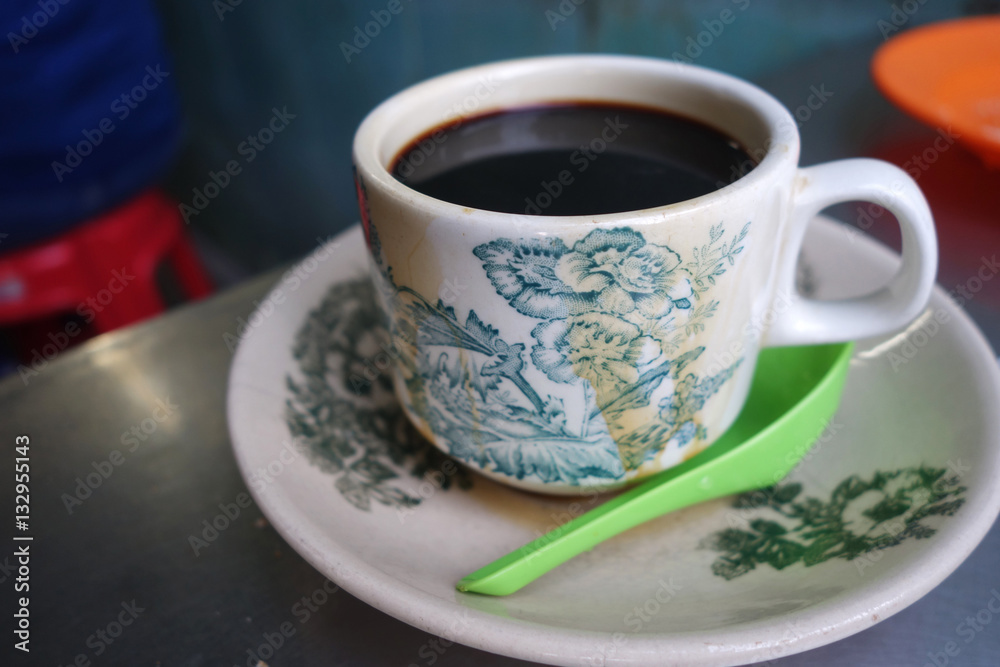 Steaming traditional oriental Chinese style dark coffee Steaming traditional oriental Chinese style dark coffee