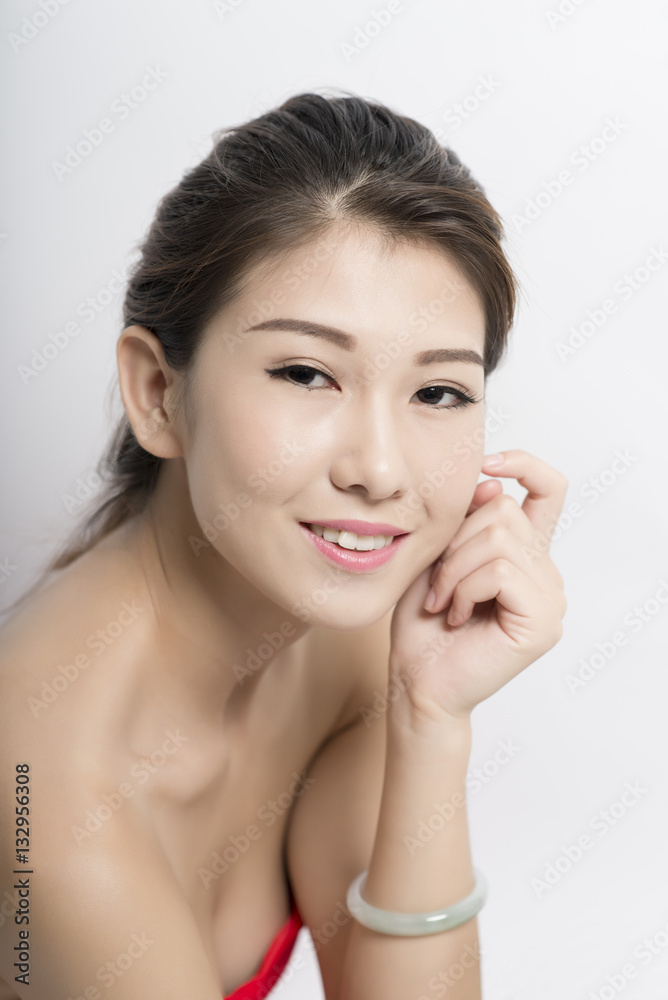 Young woman looking at camera with a seductive smile Young woman looking at camera with a seductive smile