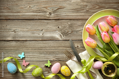 Easter table setting with spring tulips and cutlery