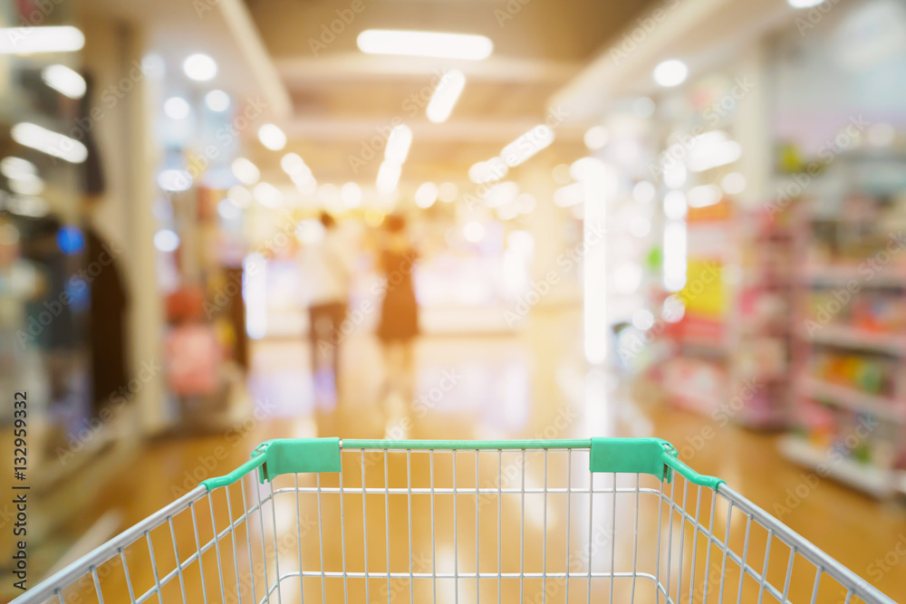 supermarket blurred background with shopping cart supermarket blurred background with shopping cart