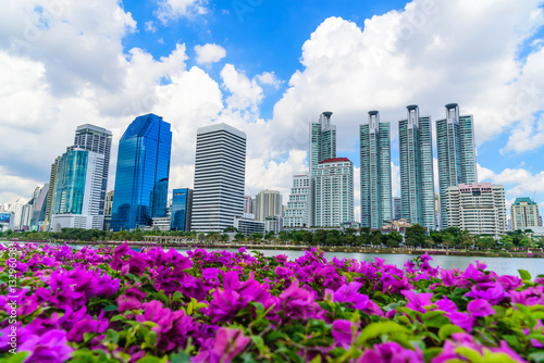 Cityscape image of Benchakitti Park at blue sky background in Bangkok, Thailand. © nuttawutnuy