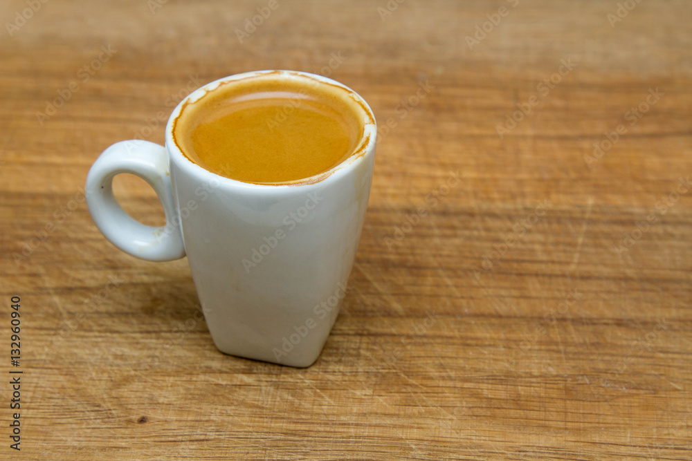 hot cup of espresso on a wooden background hot cup of espresso on a wooden background