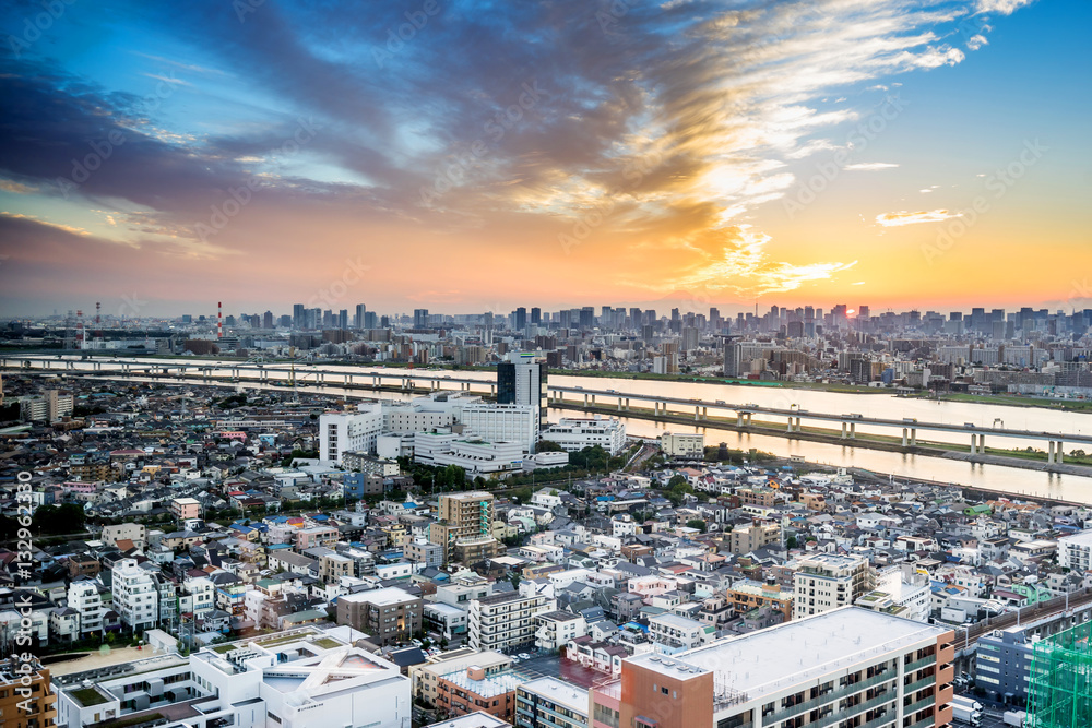 Obraz premium Business and culture concept - panoramic modern city skyline bird eye aerial view with Mountain Fuji under dramatic sunset glow and beautiful cloudy sky in Tokyo, Japan