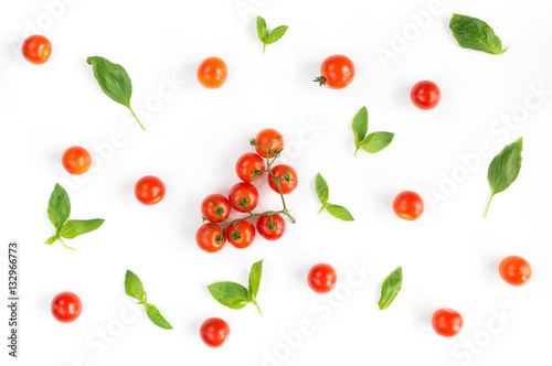 Italian food pattern with red tomatoes and basil leafs isolated on white background