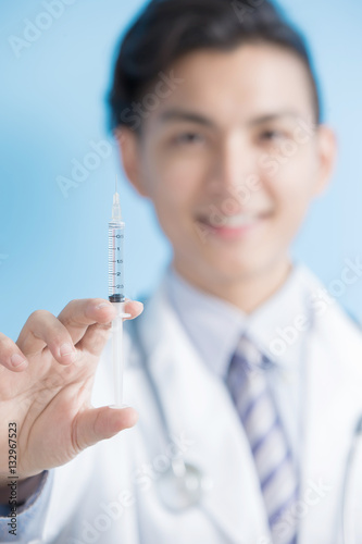 doctor show syringe to you