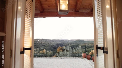 camera tracking through window of a villa revealing the view