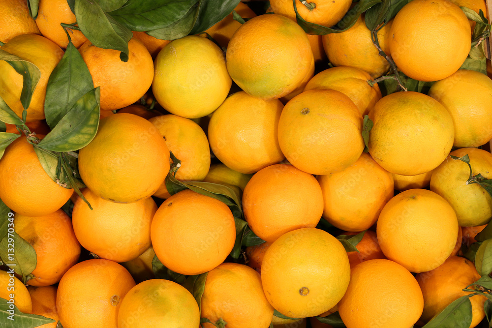 oranges without chemical treatments with green leaves