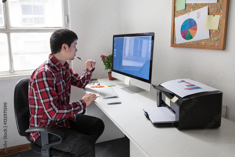 Young man working at office