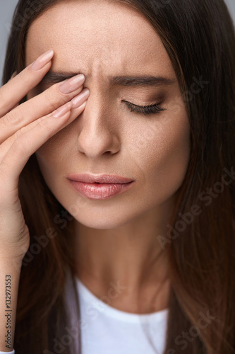 Woman Suffering From Strong Pain  Having Headache  Touching Face