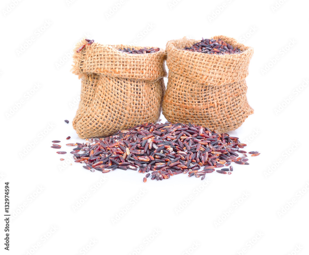 rice berry or organic rice in Gunny bag on white background
