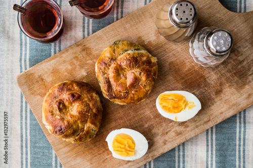 Turkish Borek Boyoz with egg and tea. photo