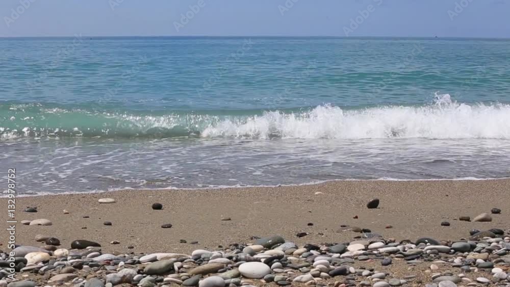 Sea beach with waves. Beautiful sea wave. Relaxation. An empty sea beach. Sea waves. Sea waves near the beach. Stones in water and sand. Sea beach with waves. Beautiful sea wave. Relaxation. An empty sea beach. Sea waves. Sea waves near the beach. Stones in water and sand.