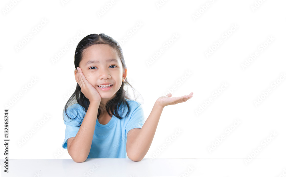 Asian little girl sitting chin and showing hand isolated on whit Asian little girl sitting chin and showing hand isolated on whit
