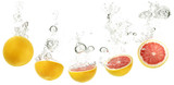 red oranges dropping into water on white background