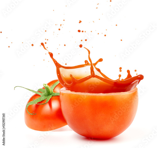 splashing tomato juice isolated on white background photo