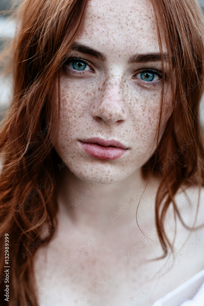 Beautiful redhead girl with blue eyes Stock Photo | Adobe Stock