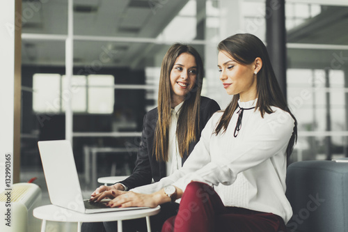 Young businesswomen working...