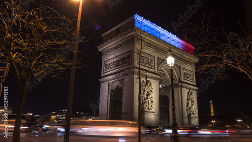 Triumphal Arch in Paris illuminated for Christmas in night © Bote