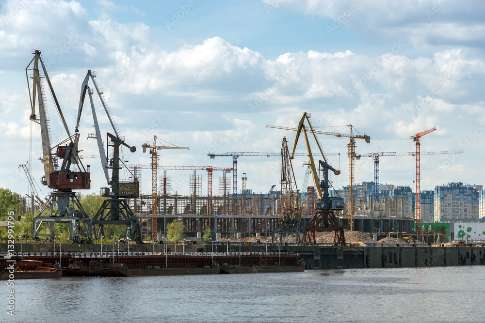 Nizhny Novgorod. Port cranes on the Strelka and the construction of stadium for the World Cup