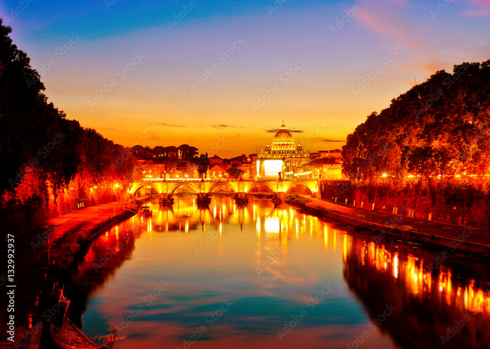 Fototapeta premium View of St. Peter's Basilica and Aelian Bridge at dusk in Rome