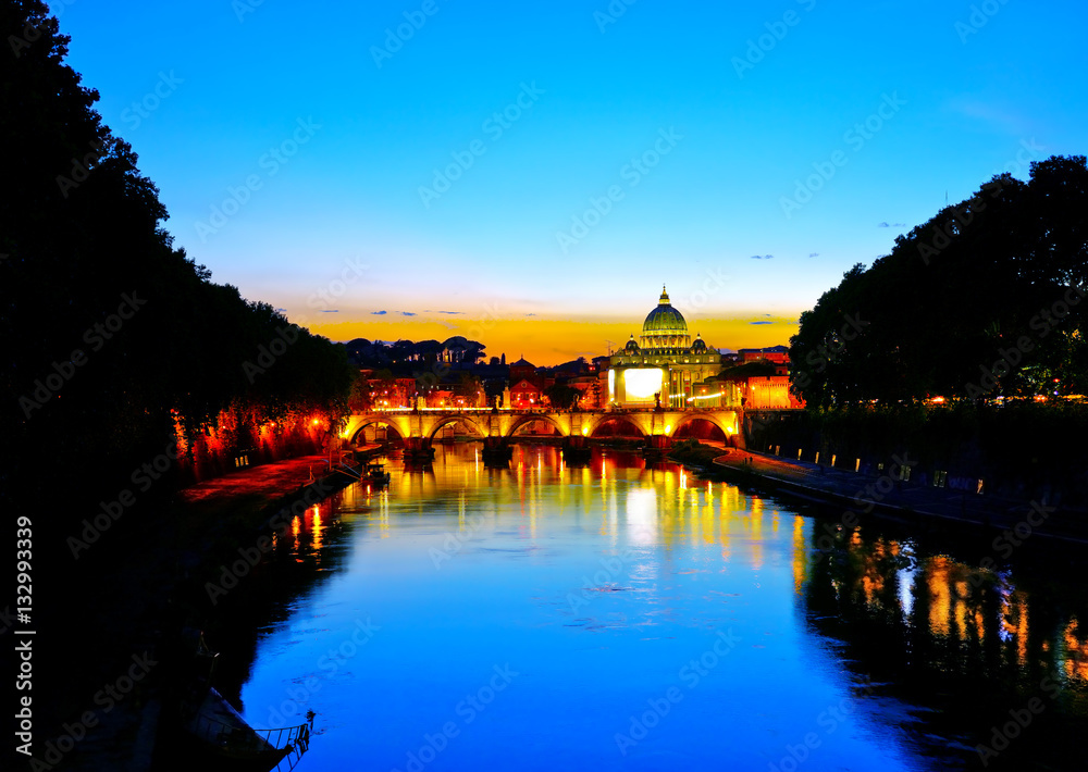 View of St. Peter's Basilica and Aelian Bridge at dusk in Rome