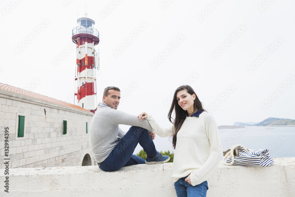 Young couple taking a break at the seaside Young couple taking a break at the seaside