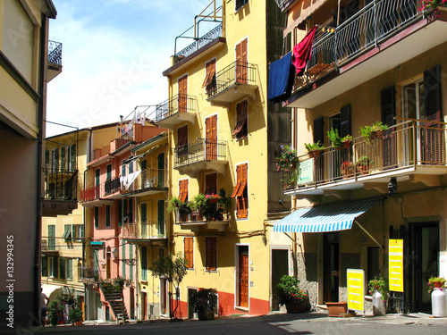 Narrow street of Manarola, fishing village in Five lands, Cinque Terre National Park in the evening, Liguria, Italy.