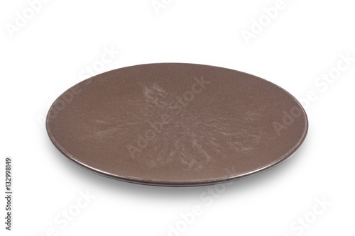 Dark brown flat shallow ceramic plate on white background directly from side