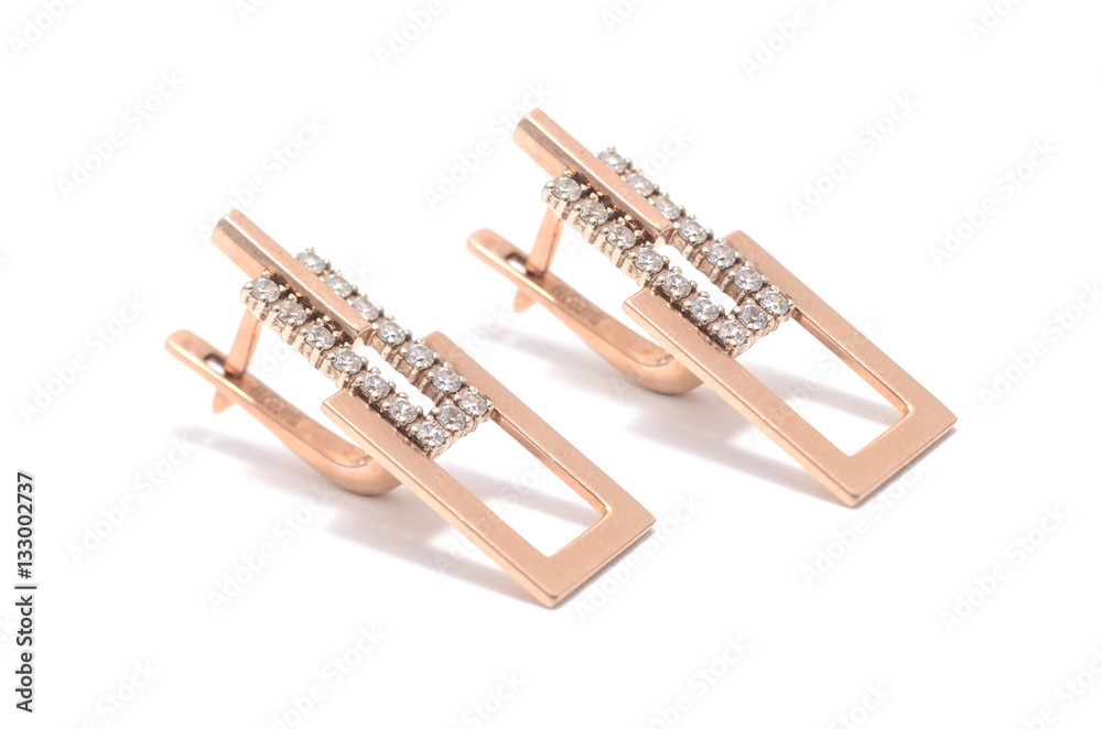 gold earrings with diamonds isolated on white gold earrings with diamonds isolated on white