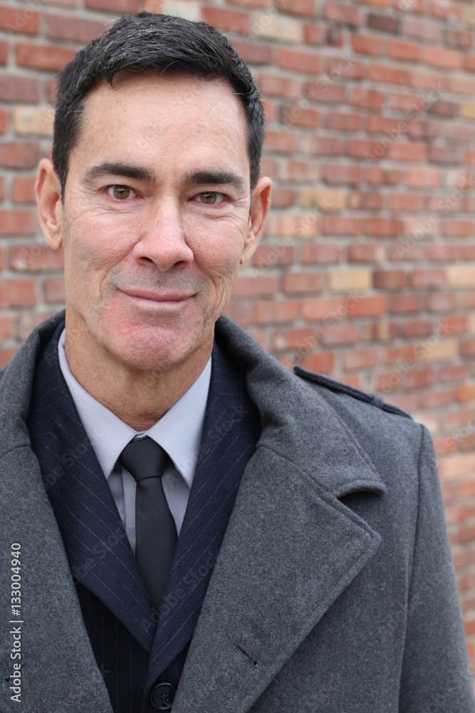 Mature handsome Caucasian businessman smiling Mature handsome Caucasian businessman smiling