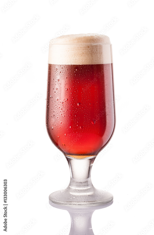 dark cold beer in frosty glass isolated on white dark cold beer in frosty glass isolated on white