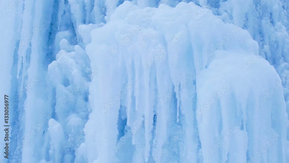Ice surface. Icy waterfall. blue background Ice crystals. Ice surface. Icy waterfall. blue background Ice crystals.