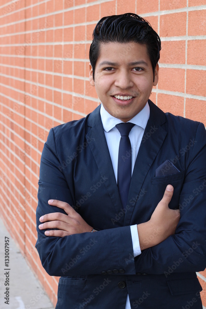 Young businessman smiling at the camera with teeth - Stock image Young businessman smiling at the camera with teeth - Stock image